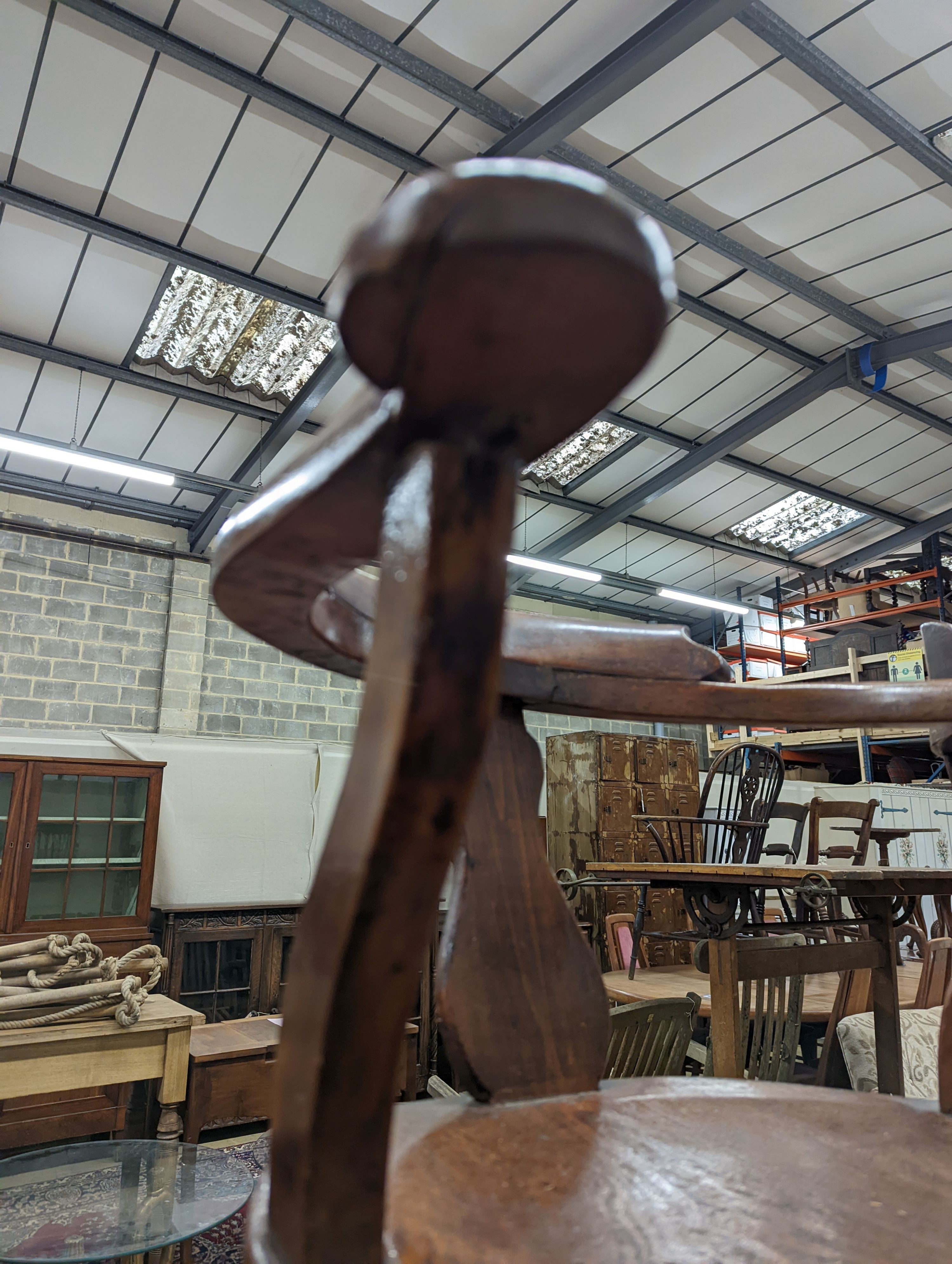 Two early 20th century swivel desk chairs and another chair.